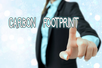 Writing note showing Carbon Footprint. Business concept for amount of dioxide released atmosphere...