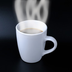 Close up shot Americano or Black coffee cup The white smoke evaporates on black background, Drink before exercise, Refresh in the morning concept.
