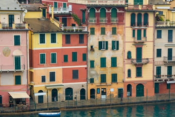 Fototapeta na wymiar Close up : Colorful houses at square of Portofino. Portofino is a resort famous for its picturesque harbour.