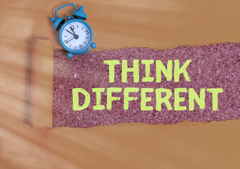 Conceptual hand writing showing Think Different. Concept meaning be unique with your thoughts or...