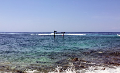 Sea view from tropical beach with sunny sky.