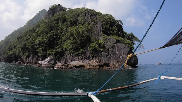 Boat ride on island hopping, El Nido around rocky cape