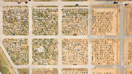 Aerial photo of new cemetery graveyard showing the headstones and tombstones of the graves some are...