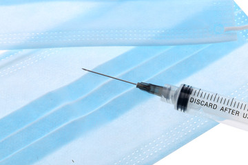injection over a table with medicaments and coronavirus blood test. Vaccine concept.