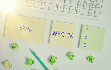 Writing note showing Brand Marketing. Business concept for Creating awareness about products around...