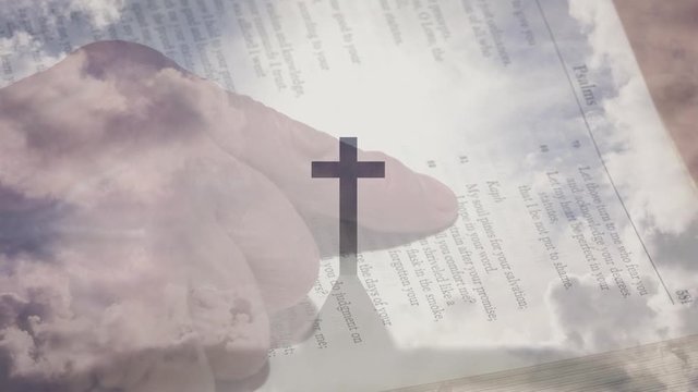 Animation of a Christian cross over a person reading the Holy Bible