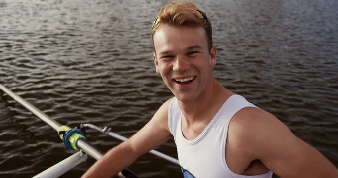 Male rower laughing and smiling at the camera
