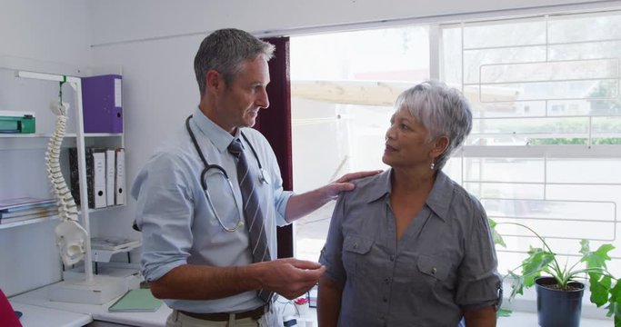 Doctor examining a senior woman in a retirement home