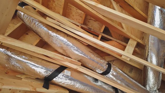 New house of air conditioner vents in new home construction under the roof