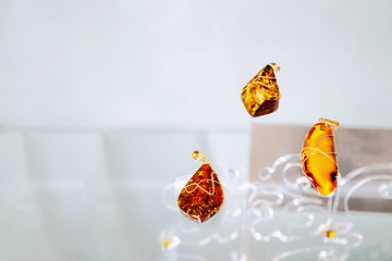 Amber necklaces  on the glass shelf