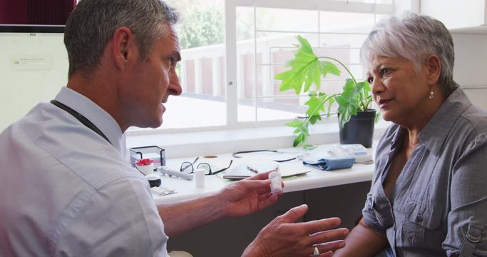 Doctor examining a senior woman in a retirement home
