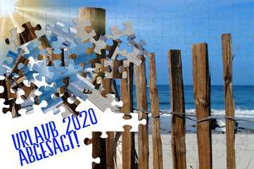Ein Strand als Puzzle und Hinweis Urlaub 2020 abgesagt