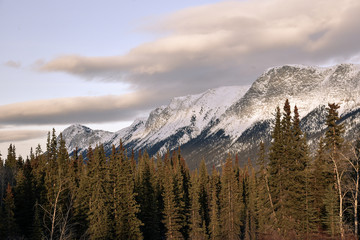 Stunning mountains seen in northern Canada, Yukon Territory at sunset in the winter with snow capped peaks. 