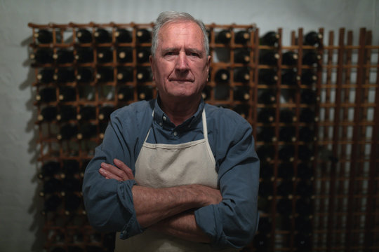  Senior winemaker in his wine cellar