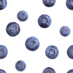 Seamless blueberry pattern. Falling or flying berries isolated on white. Fresh fruit summer pattern.