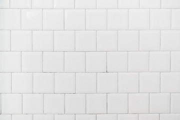 White tile interior wall background.