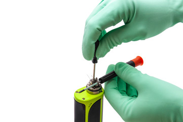Naklejka premium Repair of an electronic cigarette on a white background