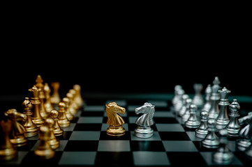 Business competition and strategy plan concept. Chess board game gold and silver colour
