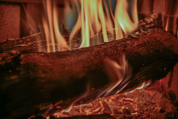 Stock image of a roaring wood fire in fire place with real wood. 
