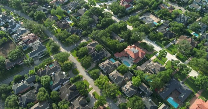 Aerial view of affluent homes in the Uptown Galleria area in Houston.  This video was filmed in 4k for best image quality.