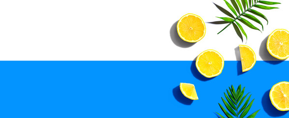 Fresh yellow lemons overhead view - flat lay - obrazy, fototapety, plakaty