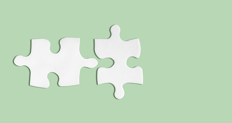 Paper puzzle pieces mockup isolated on green background. Ideal matching, partnership concept.