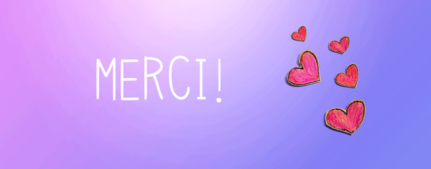 Merci - Thank you in french language with red heart drawings - flatlay
