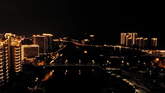 aerial panorama view cars driving over bridge urban cityscape at night tim