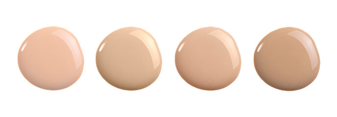 Beige liquid foundation shades, concealer smear smudge drop. Makeup cosmetic swatch isolated on white.
