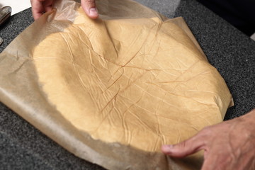 Transfer pastry sheet on baking tin. Making Cider Pie Series.