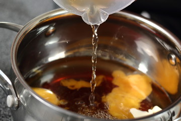 Pouring Water in pan with yolks, butter, cider, maple syrup. Making Cider Pie Series.