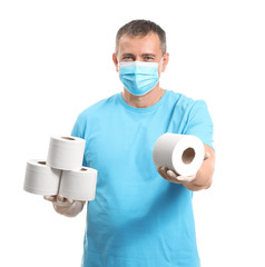 Mature man in protective mask and with toilet paper on white background. Concept of coronavirus...