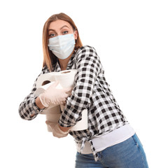 Woman in protective mask and with toilet paper on white background. Concept of coronavirus epidemic