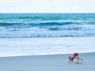 Asia girl play on the beach on beautiful sea and sky.