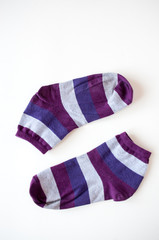Socks with colored stripes on a light background