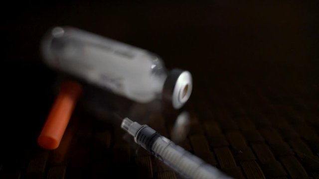 Closeup Of Medicine Vial And Syringe, Pharmaceutical Industry.