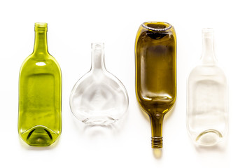 Pattern of bottles on white table top-down