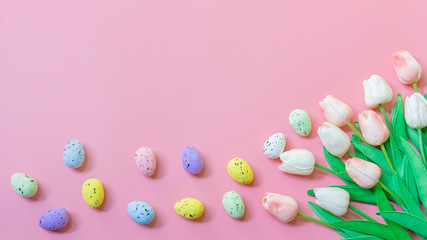 Fototapeta na wymiar Happy easter, Top view of Easter eggs and tulip flower on pink color backgroud