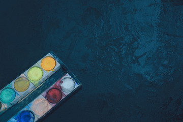 Color tray box on black background  use of color to create beautiful works, Artist preparation concepts before drawing