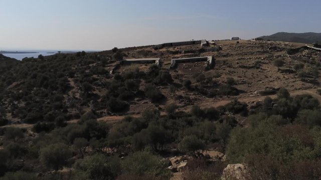 Drone flight through a lost place urbex buildings in the green mountains of greece.