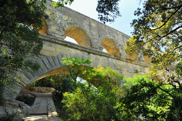 ancient Roman aqueduct In FRANCE with river beneath it