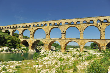 Fototapeta na wymiar ancient Roman aqueduct In FRANCE with river beneath it