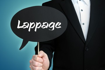 Lappage. Lawyer in suit holds speech bubble at camera. The term Lappage is in the sign. Symbol for law, justice, judgement