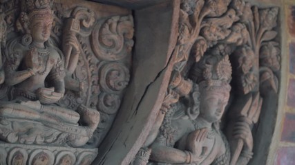 Ancient And Religious Wood Carvings Decorated On The Brick Wall. Patan Durbar Square In Kathmandu, Nepal.  - close up panning shot