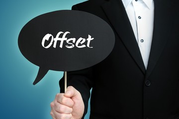 Offset. Lawyer in suit holds speech bubble at camera. The term Offset is in the sign. Symbol for...