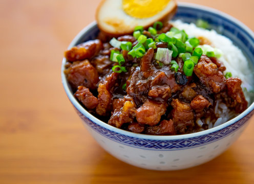 braised pork rice on wooden background