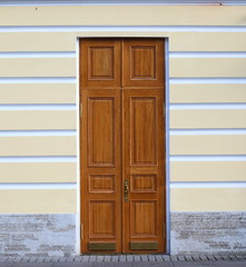 Big old light wooden door