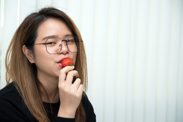 Woman eat strawberry red berry fruit sweet juicy