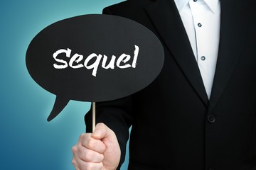 Sequel. Lawyer in suit holds speech bubble at camera. The term Sequel is in the sign. Symbol for law, justice, judgement