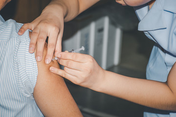 Patient asian woman get vaccinated the flu covid19